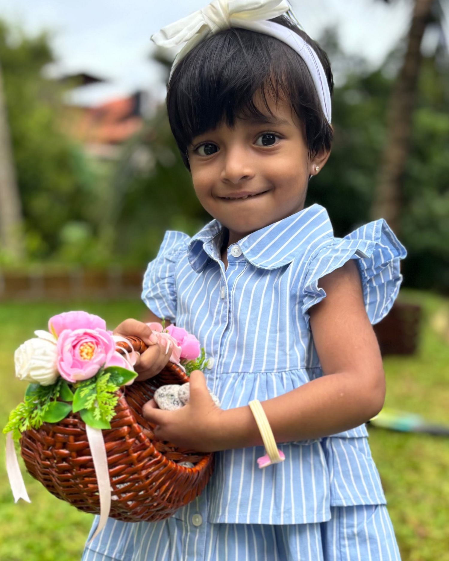 Girl  blue dress with vertical white stripes; very cute for 2 to 9 year olds